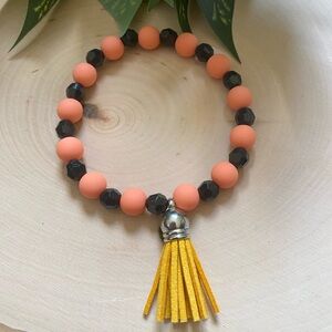 Orange & Black Silicone/Crystal Beaded Bracelet With Tassel Charm Size 8 Inches